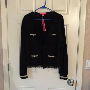 Lilly black sweater with metallic gold trim.